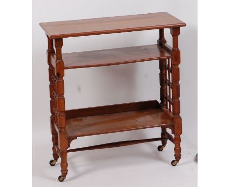 Leonard Francis Wyburd RA (1865-1958) for Liberty & Co - An Arts & Crafts three tier side table, raised on part ring turned a