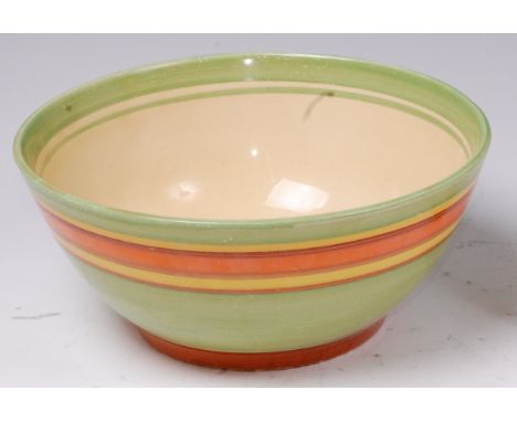 A 1930s Clarice Cliff Bizarre Liberty pattern table bowl, of circular form, painted in bands of yellow, green, brown and oran