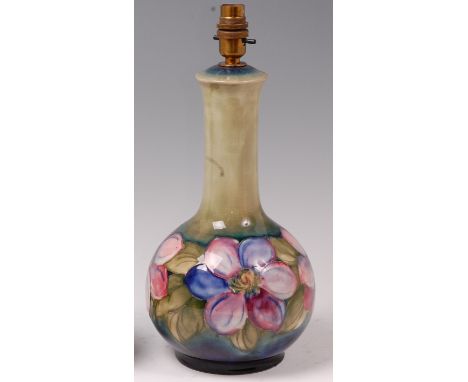 An early 20th century Moorcroft pottery table lamp, in the Anemone pattern, underglaze painted and tube-line decorated, of lo