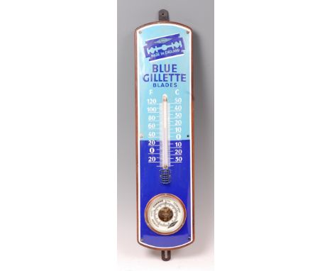 A 1930s blue Gillette Blades advertising combination thermometer and barometer, the enamel front applied onto oak back, h.64c