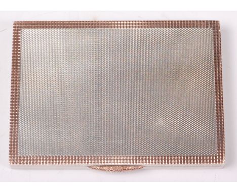 A late Art Deco silver engine turned pocket card case, having applied gold border and latch, with gilt washed interior, Birmi