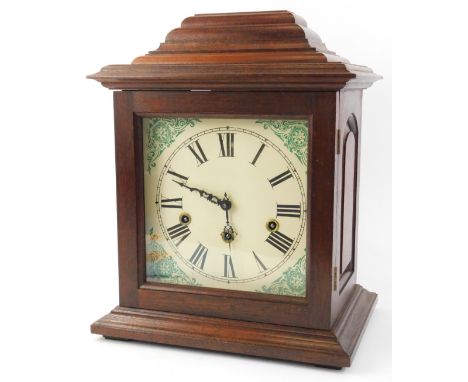 A German mantel clock, the printed dial with Roman numerals, in a mahogany case, 38cm H.