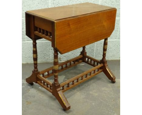 A Victorian walnut aesthetic style drop leaf trolley, with parcel gilt decoration, the rectangular top with canted corners on