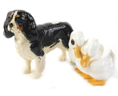 A Beswick ceramic model of a King Charles spaniel, and a Royal Osborne duck group (2)