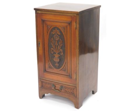 An Edwardian mahogany music cabinet, with a single carved door above a frieze drawer, on bracket feet, 45cm W.