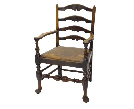 A 19thC oak ladder back armchair, with a drop in seat on cabriole legs with pad feet.