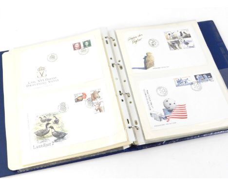 An album containing British coin covers, Royal commemorative first day covers etc.