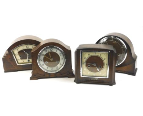 Four early to mid 20thC mantel clocks, to include an Art Deco style walnut and rosewood example and three oak mantel clocks