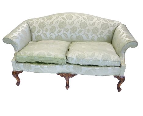 A mahogany sofa in mid 18thC style, upholstered in green damask fabric on carved cabriole legs.