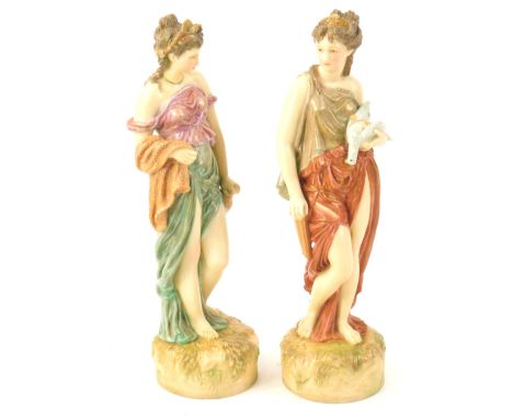 A pair of Royal Ivory porcelain Worcester style figures, modelled in the form of a Neo Classical lady holding a dead pigeon a