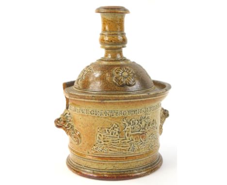 A 19thC stoneware jar and cover, the lid modelled as a candlestick, the base with two handles, stamped M.E Sargent South Hyke
