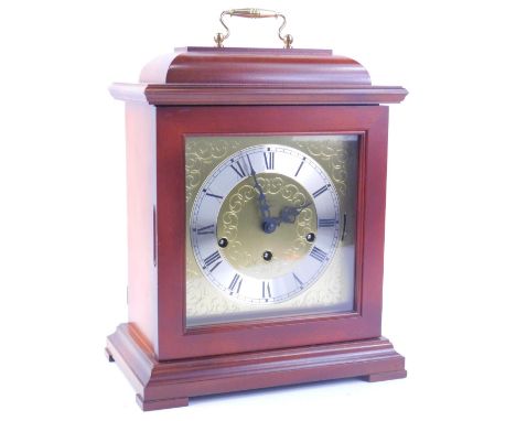 A German mahogany mantel clock, with a brass movement and Westminster chime, 30cm H