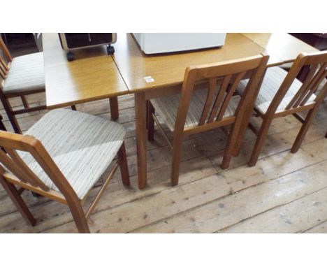 A 2'6 light oak draw leaf dining table and six similar chairs with cream patterned seats 