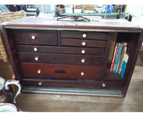 A multi-drawer storage box with contents of old tools etc 