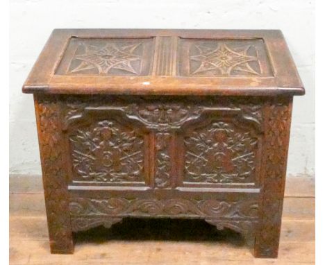 A late Victorian carved oak two panel coffer 81cms wide 50cms deep