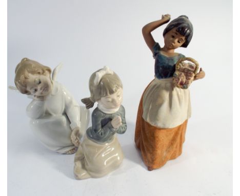 Two Nao figurines and a Lladro cherub, one of the cherubs wings has been knocked off