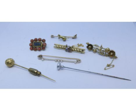 A collection of Victorian brooches and stick pins to include a coral and woven hair panel memorial brooch 