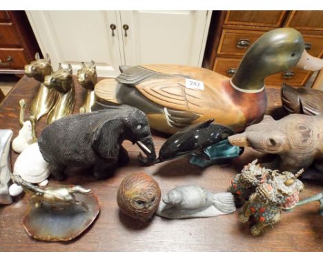 Assorted wooden ornaments to include Poole Dolphin, brass horse head, coat hooks etc