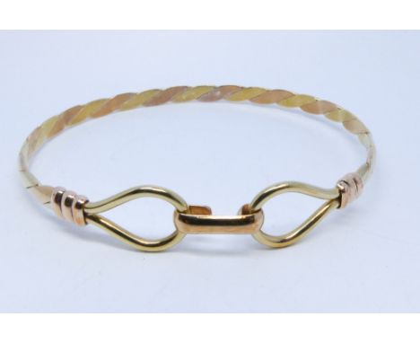 A modern 9ct rose gold ladies bangle 10.1gms 