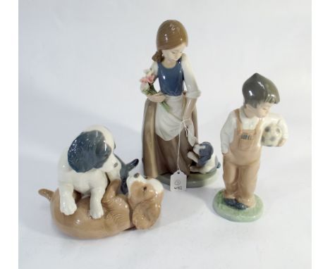 Three Nao porcelain figurines two of children the other of playing puppies 