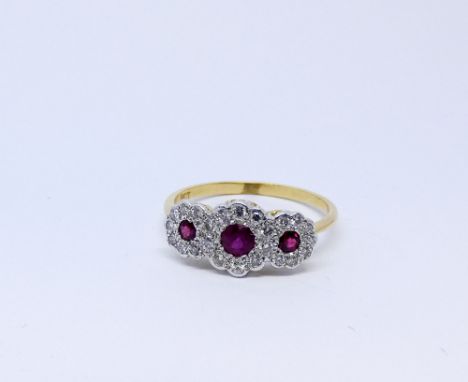 Triple ruby and diamond cluster ring, set on 18ct yellow gold shank, ring size O