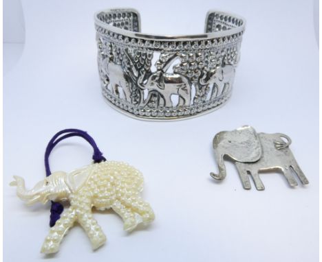 Wide sterling silver bangle with elephant motif, elephant brooch and a charm