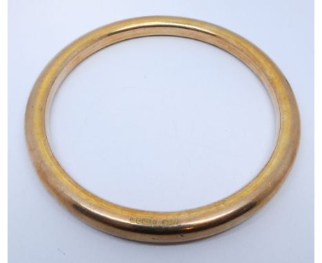 A 9ct rose gold slave bangle, gross weight 30.9gms 