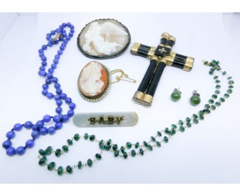 Two oval carved shell cameo brooches, a baby brooch, a row of lapis beads, jade ear studs etc, and a large Victorian crucifix