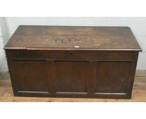 An antique oak three panel coffer 126cms wide 56cms deep 