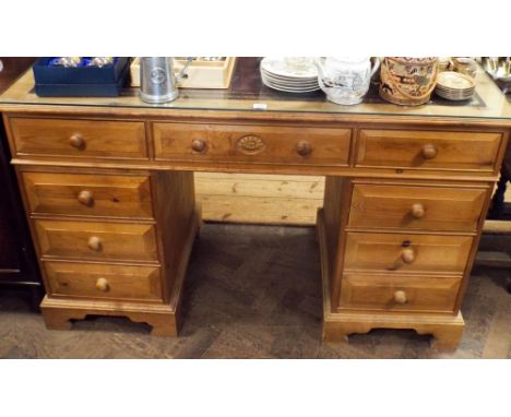 A light pine double pedestal desk fitted nine drawers with leather top 52" wide 