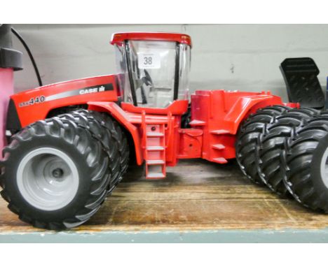 A large heavy model of a STX440 Case HH 12 wheeled tractor 