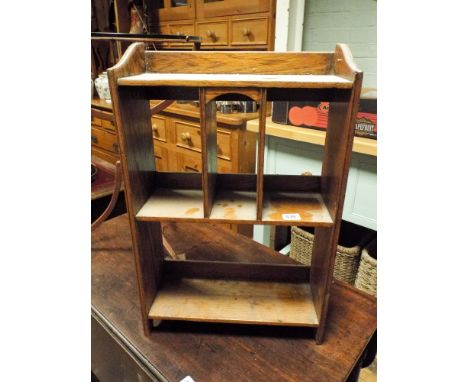 A small oak open wall shelf 