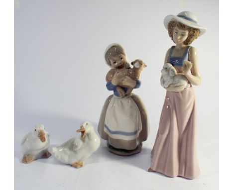 A Group of four pieces of Nao, two geese and two girls holding animals, tallest figurine height 26cms 