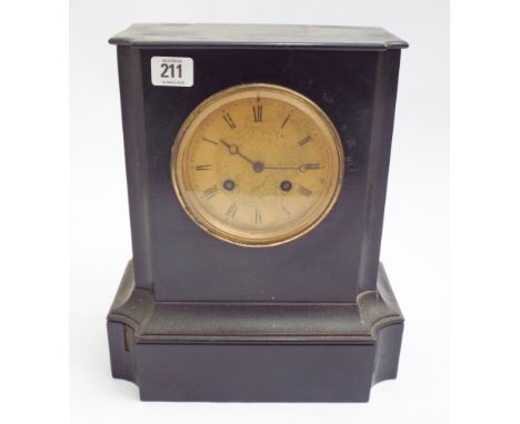 Late Victorian striking mantle clock in black wooden case with glass dial 