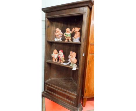 A stained pine corner shelf unit 