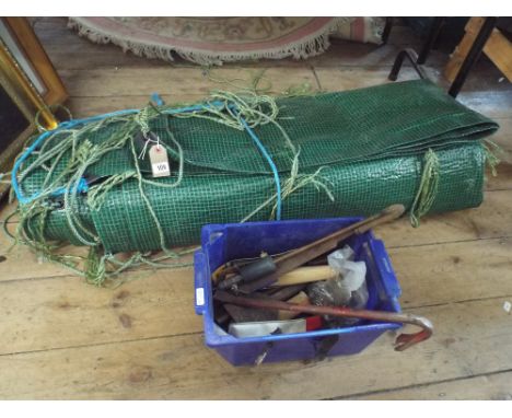 A large tarpaulin and a small quantity of hand tools 