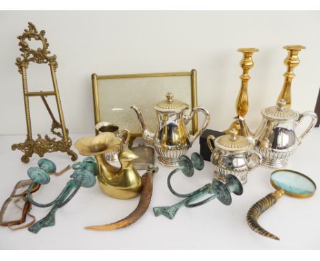 A selection of decorative ornamental metalware to include:a 40 cm easel;a pair of brass candlesticks (30 cm high);a four-piec