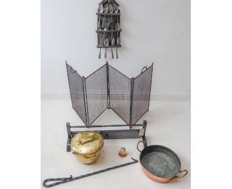 Fireside items to include:a wire mesh firescreen;a hinged lower guard and fire irons, a 19th century lidded brass cooking pot