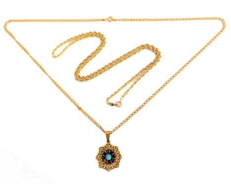A 9-carat yellow gold, turquoise and garnet circular openwork pendant suspended from a 9-carat yellow gold curb link necklace