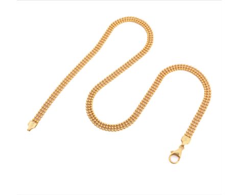 A fancy link chain necklace composed of three rows of faceted spherical beads, to the clasp stamped '750' and 'ITALY' (43.5cm