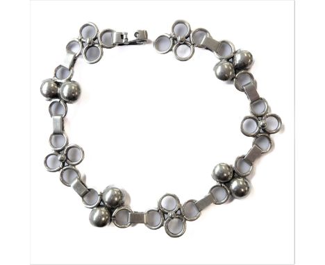 A silver bracelet modelled as chain linked stylised pierced quatrefoils (boxed)