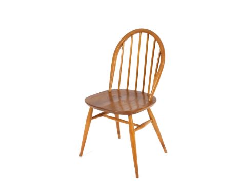 A set of four Ercol stick back kitchen chairs