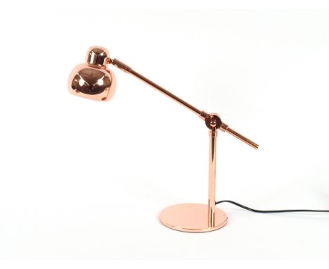 A small copper Angle Poise style lamp