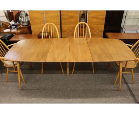 A blonde Ercol extending dining table, fitted with two extra leaves,, 223cm x 87cm