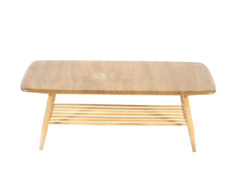 A blonde Ercol coffee table, raised on rounded supports and under-tier, 102cm wide