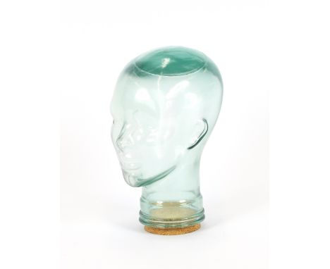 A clear glass mannequin head