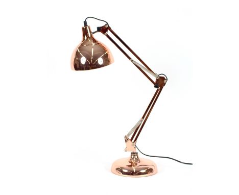 A large copper Angle Poise style lamp