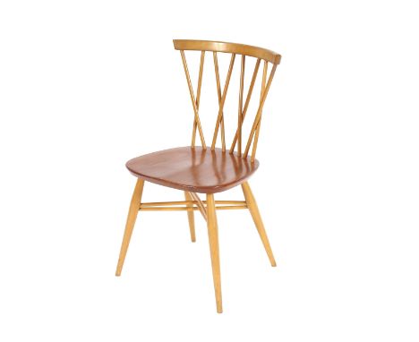 A set of four Ercol kitchen chairs, having cross over stick-backs