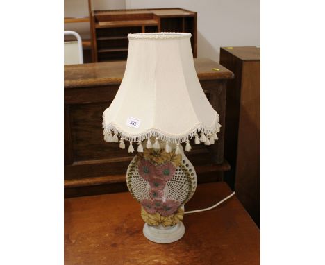 A Bernard Rooke pottery table lamp, with raised floral and pierced decorated baluster body, complete with tassled shade, 64cm