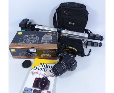 Nikon D40 digital SLR camera with 18-55mm lens, other accessories including Slik tripod and camera bag etc    Condition Repor